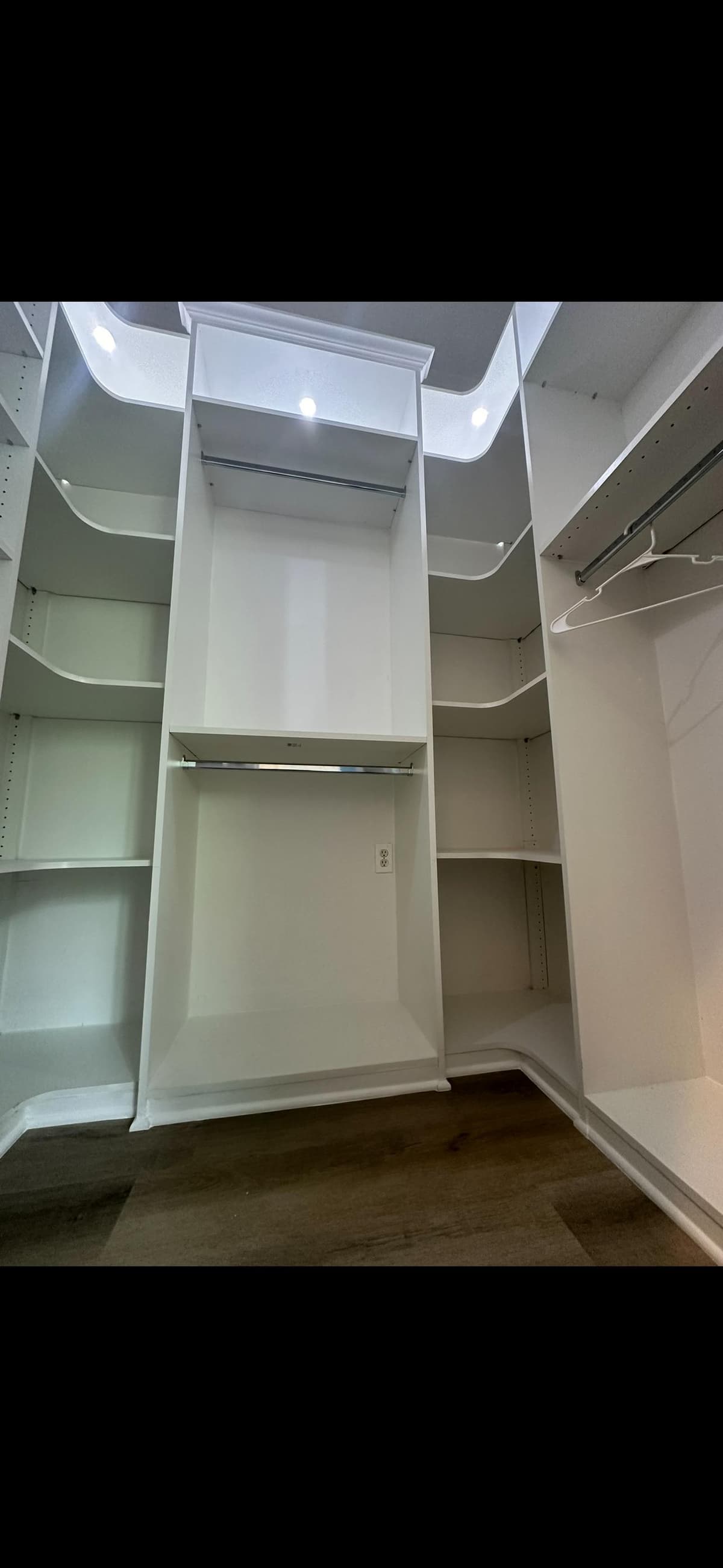 Custom walk-in closet with organized storage systems
