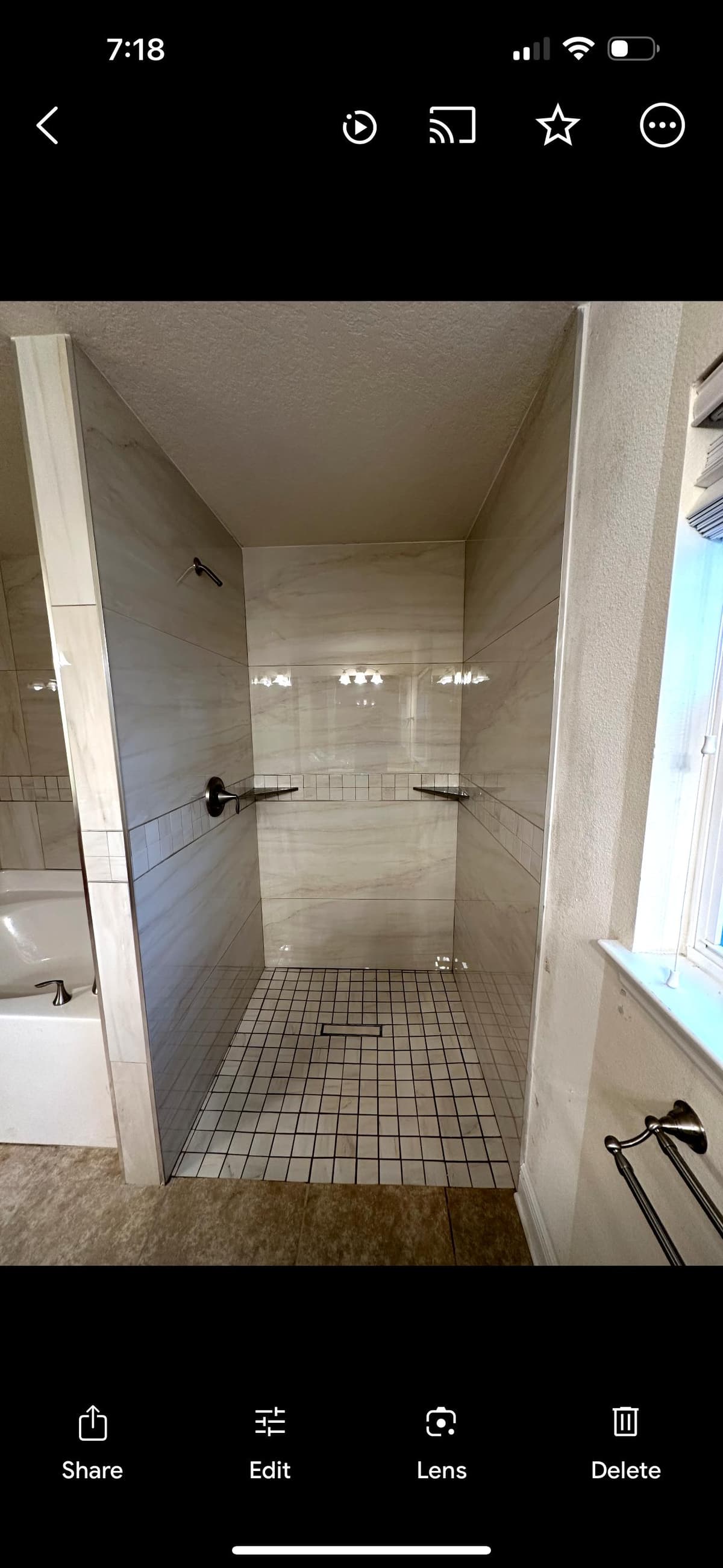 Modern walk-in shower with glass enclosure