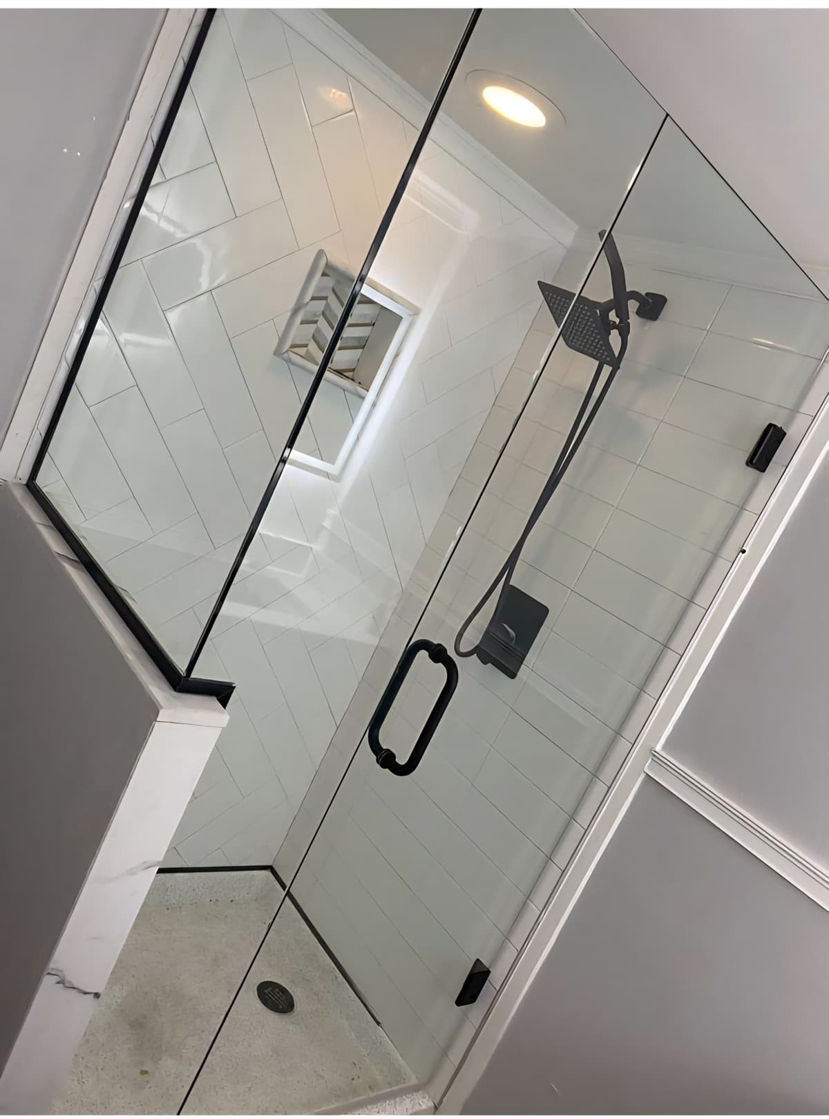 Elegant glass shower with black hardware fixtures