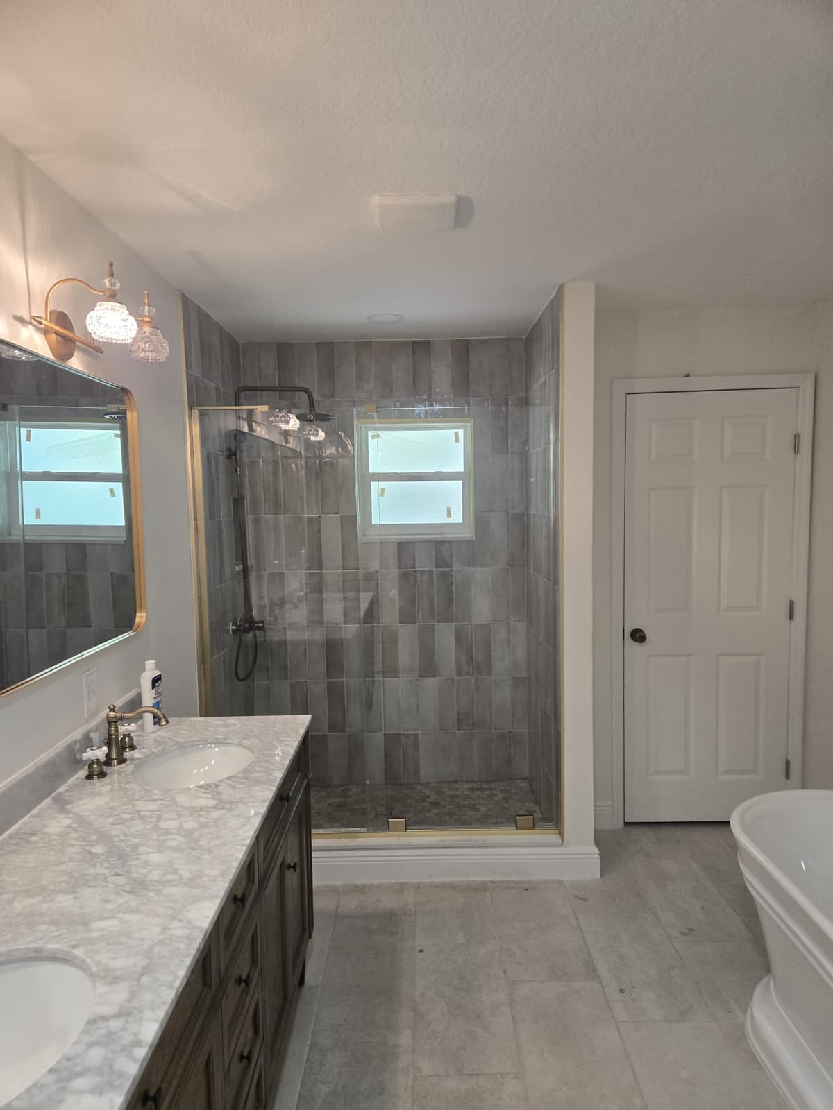 Fully renovated bathroom with marble tile
